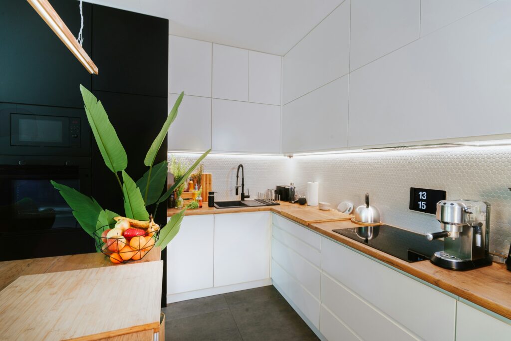 A modern, fully equipped kitchen is included in an Airbnb property, highlighting the convenience of cooking and dining amenities for guests who prefer home-like comfort during their stay.