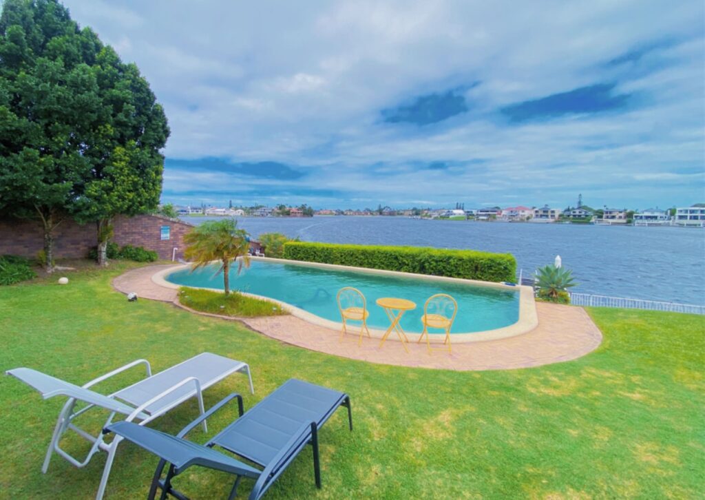 this luxurious Airbnb listing in Mermaid Waters combines functionality with breathtaking waterfront views.