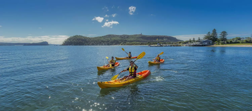 Kayaking on Pittwater: Glide through the calm waters of Pittwater, surrounded by lush bushland.